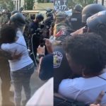 Abbraccio poliziotto e manifestante